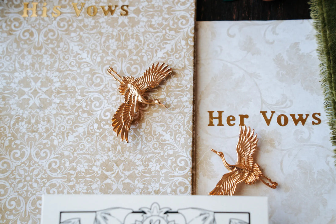Vow books with gold bird details