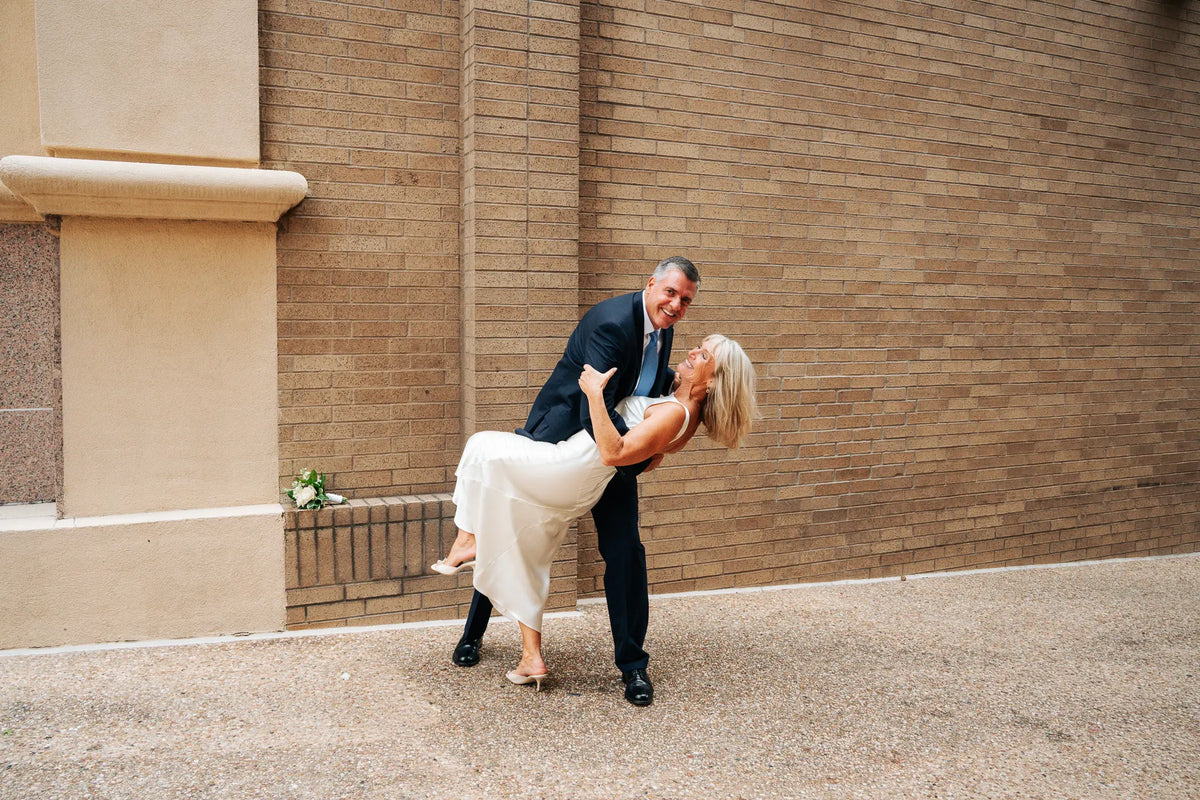 Newlyweds celebrating together outdoors in Austin.