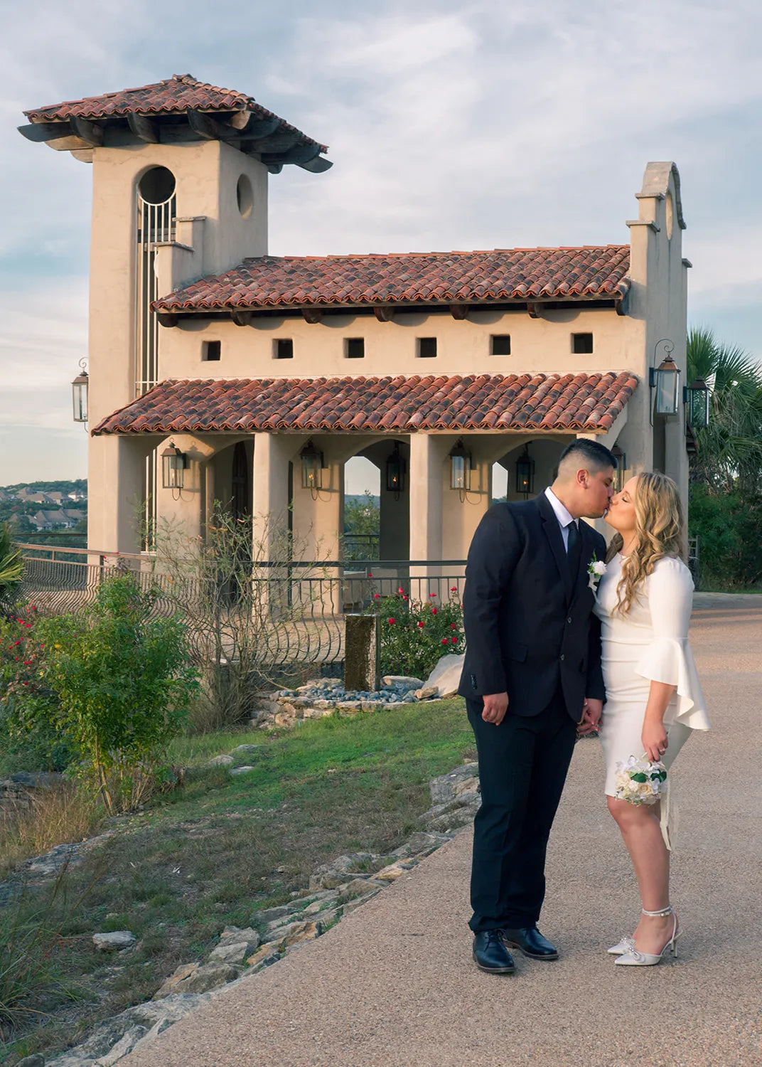 Newlyweds share a kiss outside Chapel Dulcinea.