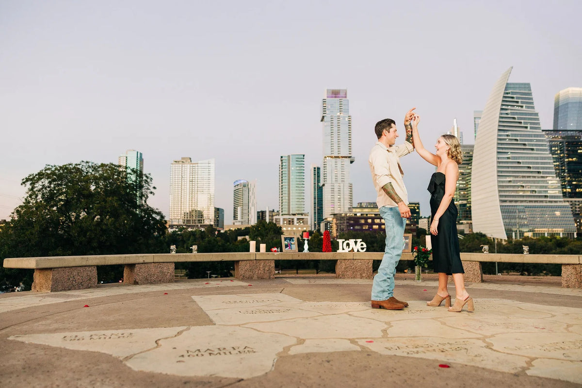 A couple walking through Butler Park near downtown Austin.
