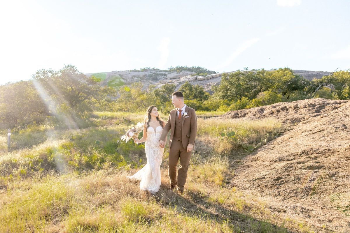 A couple exploring the pink granite landscape at Enchanted Rock.
